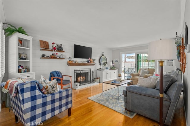 1050 Marvista Ave, Seal Beach, CA 90740 - living area with wood finished floors and a warm lit fireplace