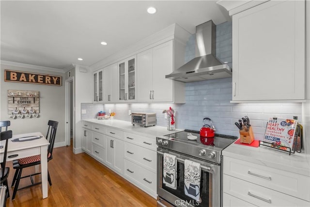 1050 Marvista Ave, Seal Beach, CA 90740 - kitchen featuring stainless steel electric range, wall chimney range hood, white cabinets, light countertops, and recessed lighting
