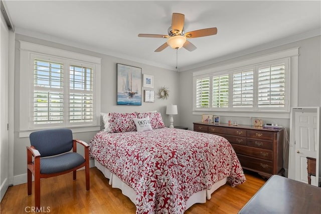 1050 Marvista Ave, Seal Beach, CA 90740 - bedroom featuring wood finished floors, crown molding, and ceiling fan