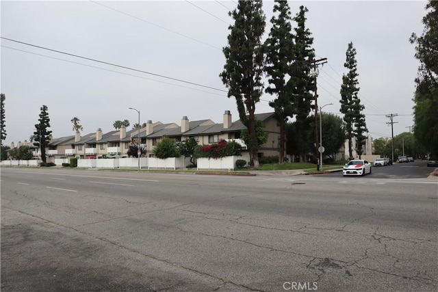 8341 De Soto Ave Unit 10, Canoga Park, CA 91304 - view of asphalt street with a residential view, street lights, traffic signs, and sidewalks
