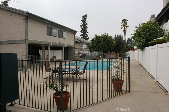 8341 De Soto Ave Unit 10, Canoga Park, CA 91304 - community pool with a fenced backyard and a patio area
