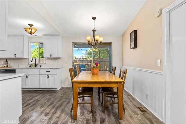 5655 Clearwater Dr, Yorba Linda, CA 92887 - dining area with a chandelier, dark wood-style floors, and a wainscoted wall