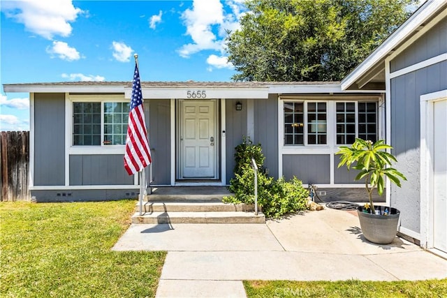 5655 Clearwater Dr, Yorba Linda, CA 92887 - view of exterior entry with a yard and crawl space