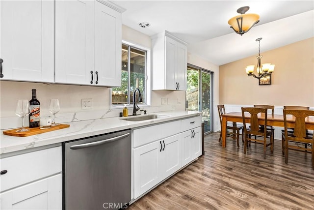 5655 Clearwater Dr, Yorba Linda, CA 92887 - kitchen with stainless steel dishwasher, wood finished floors, white cabinetry, a chandelier, and pendant lighting