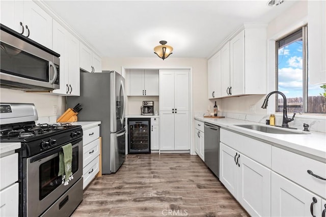 5655 Clearwater Dr, Yorba Linda, CA 92887 - kitchen with stainless steel appliances, beverage cooler, white cabinets, and light countertops