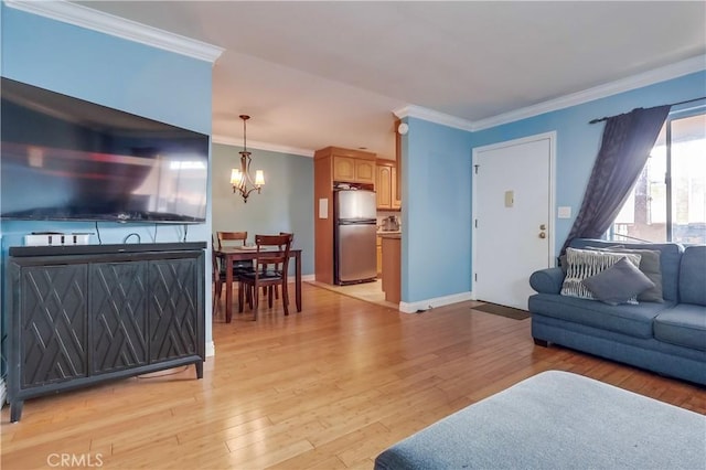2501 W Redondo Beach Blvd Unit 306, Gardena, CA 90249 - living area with a chandelier, ornamental molding, and light wood-type flooring