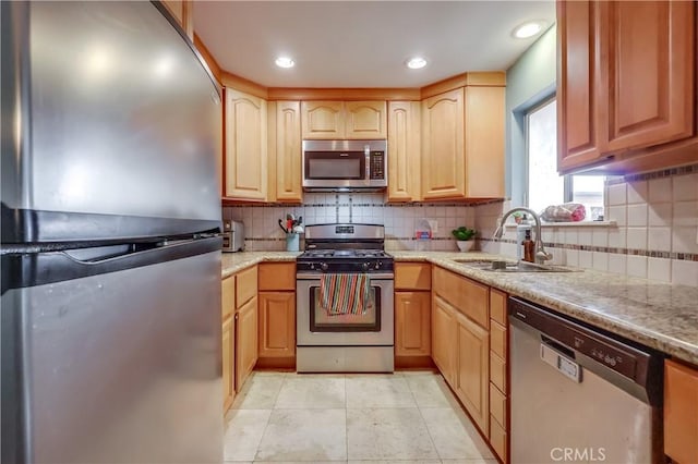 2501 W Redondo Beach Blvd Unit 306, Gardena, CA 90249 - kitchen with appliances with stainless steel finishes, backsplash, light stone countertops, light tile patterned floors, and recessed lighting