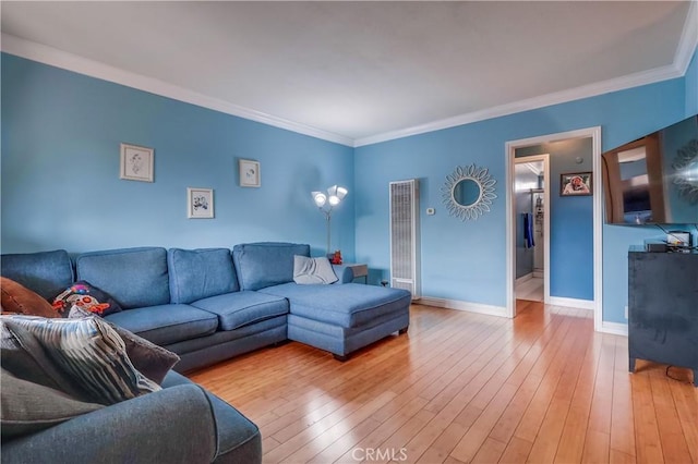 2501 W Redondo Beach Blvd Unit 306, Gardena, CA 90249 - living room with a heating unit, light wood finished floors, and ornamental molding