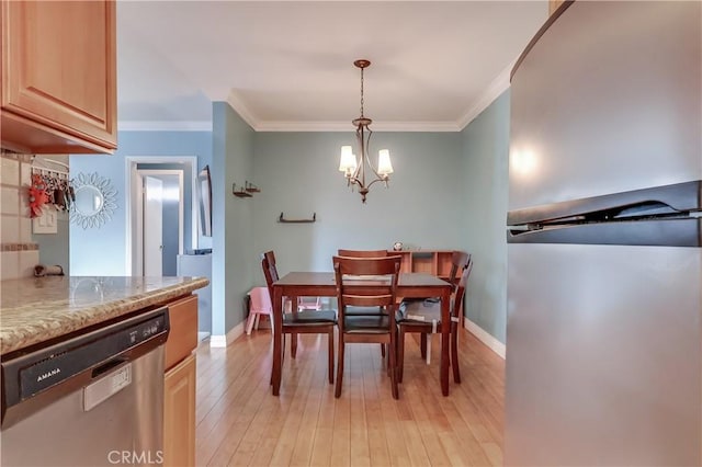 2501 W Redondo Beach Blvd Unit 306, Gardena, CA 90249 - dining area with ornamental molding, light wood-style floors, and a chandelier
