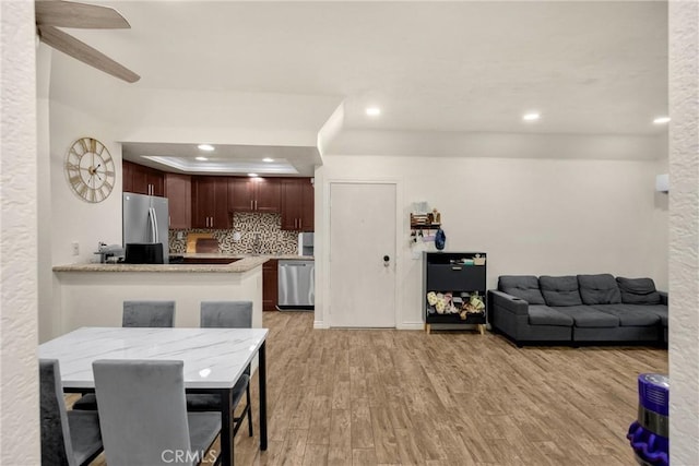 22709 Lakeway Dr Unit 493, Diamond Bar, CA 91765 - dining area featuring light wood-style floors, recessed lighting, a tray ceiling, and a ceiling fan