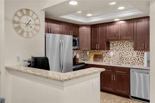 22709 Lakeway Dr Unit 493, Diamond Bar, CA 91765 - kitchen with appliances with stainless steel finishes, a tray ceiling, recessed lighting, decorative backsplash, and dark brown cabinets