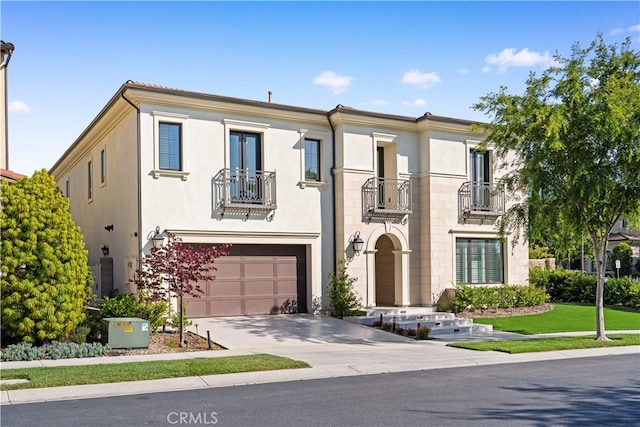 127 Interstellar, Irvine, CA 92618 - view of front of house with a balcony, driveway, a garage, and stucco siding
