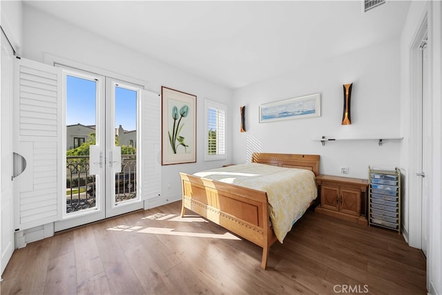 127 Interstellar, Irvine, CA 92618 - bedroom with access to exterior, french doors, and wood finished floors