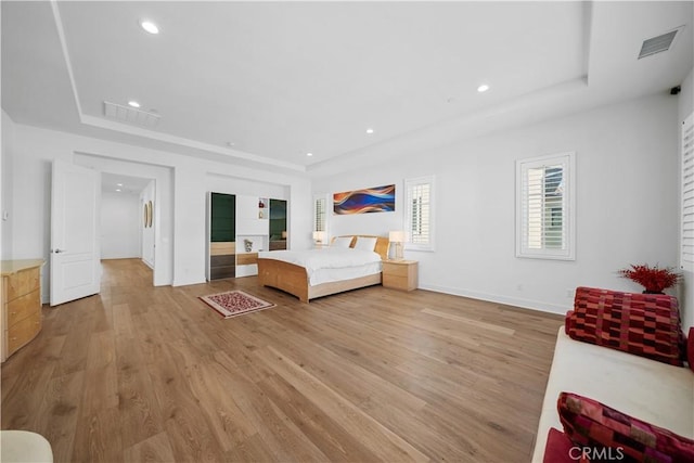 127 Interstellar, Irvine, CA 92618 - bedroom featuring a tray ceiling, light wood-type flooring, and recessed lighting