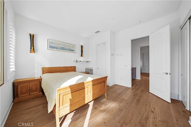 127 Interstellar, Irvine, CA 92618 - bedroom with light wood-type flooring and a closet