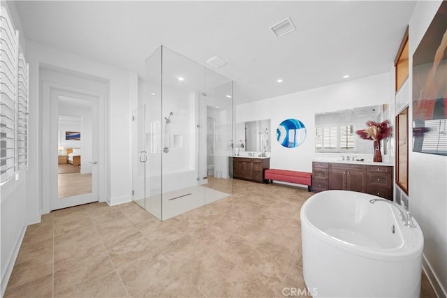 127 Interstellar, Irvine, CA 92618 - bathroom featuring a shower stall, vanity, and a freestanding tub