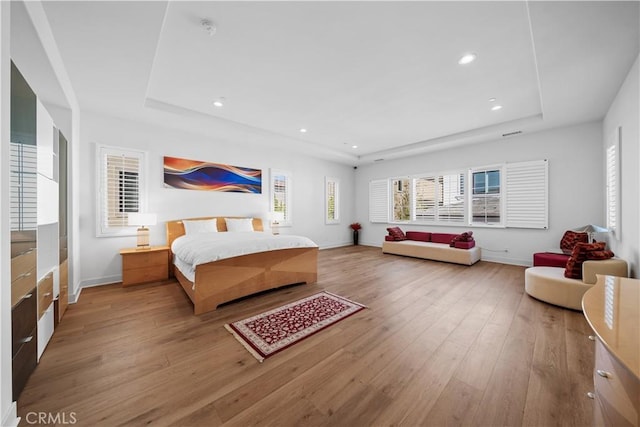 127 Interstellar, Irvine, CA 92618 - bedroom featuring a raised ceiling, light wood-type flooring, and recessed lighting