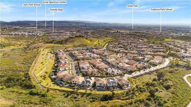 127 Interstellar, Irvine, CA 92618 - aerial view of property's location with nearby suburban area and a mountainous background