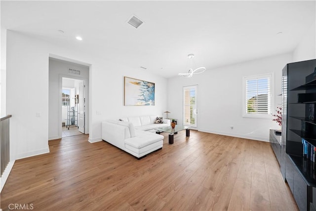 127 Interstellar, Irvine, CA 92618 - living area featuring light wood-type flooring, a chandelier, and recessed lighting