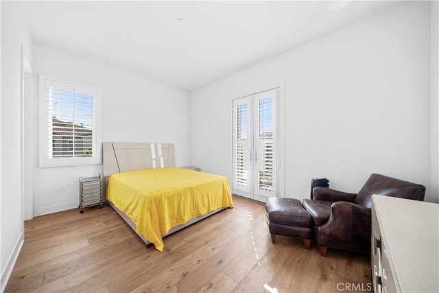 127 Interstellar, Irvine, CA 92618 - bedroom with multiple windows, light wood finished floors, and access to exterior