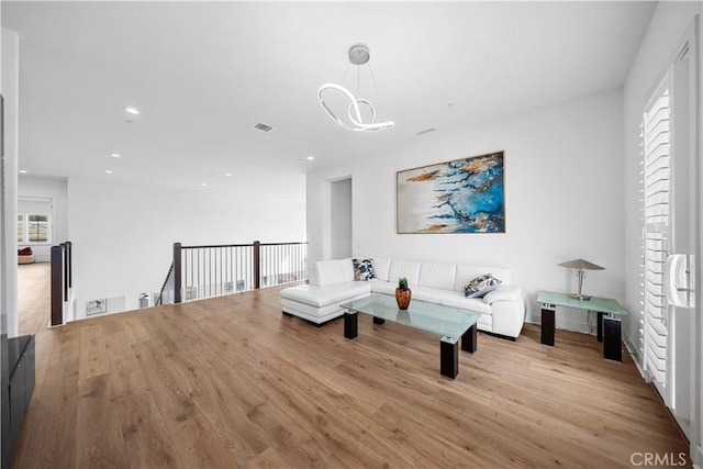 127 Interstellar, Irvine, CA 92618 - living room with wood finished floors, a chandelier, and recessed lighting