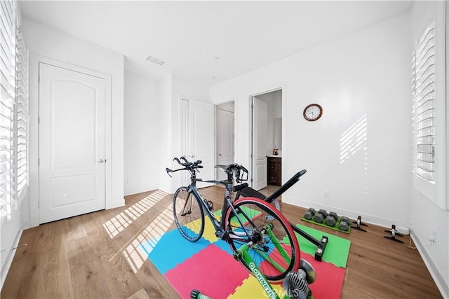 127 Interstellar, Irvine, CA 92618 - exercise area featuring plenty of natural light and wood finished floors