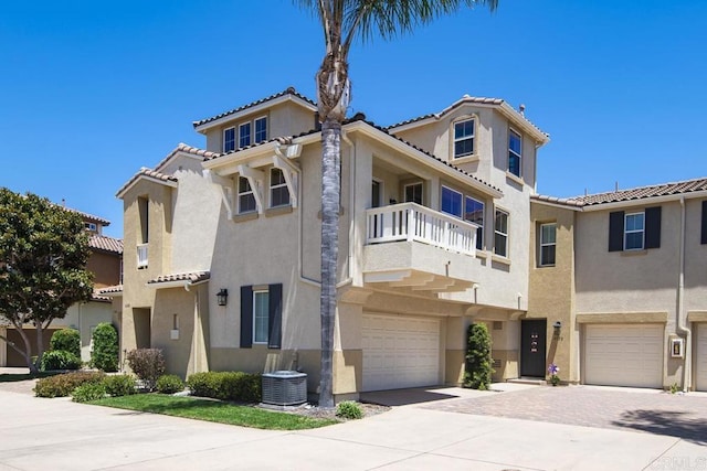 4148 Karst Rd, Carlsbad, CA 92010 - view of front of home featuring stucco siding, a garage, a balcony, and a tiled roof