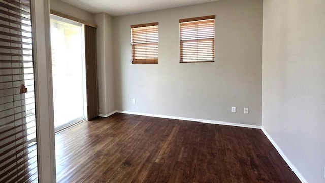 4148 Karst Rd, Carlsbad, CA 92010 - empty room with healthy amount of natural light and dark wood-type flooring