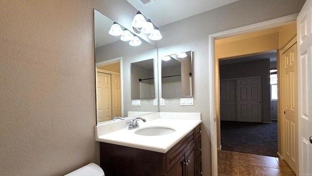 4148 Karst Rd, Carlsbad, CA 92010 - bathroom with vanity, tile patterned flooring, and a textured wall
