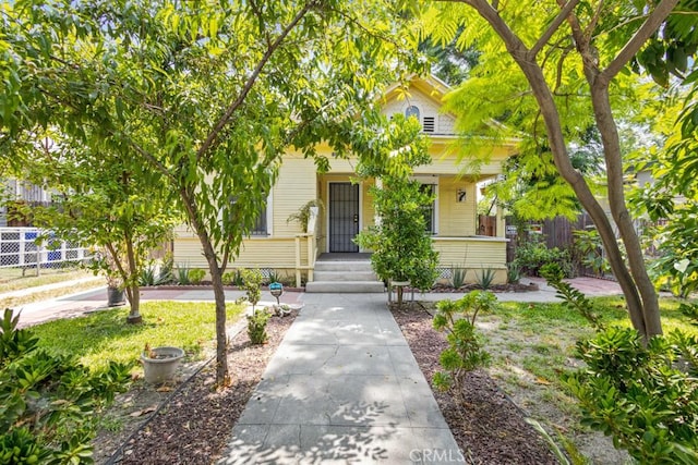 1085 N Arrowhead Ave, San Bernardino, CA 92410 - view of property hidden behind natural elements featuring covered porch