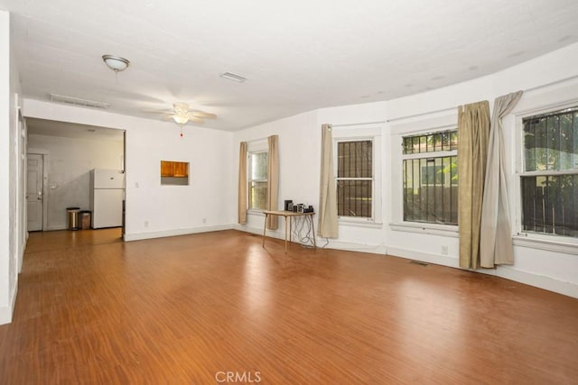 1085 N Arrowhead Ave, San Bernardino, CA 92410 - unfurnished living room with a ceiling fan and wood finished floors