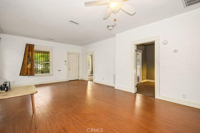 1085 N Arrowhead Ave, San Bernardino, CA 92410 - unfurnished living room featuring a ceiling fan and wood finished floors