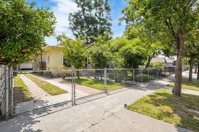 1085 N Arrowhead Ave, San Bernardino, CA 92410 - view of front of home with a fenced front yard and a gate