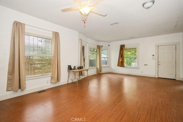 1085 N Arrowhead Ave, San Bernardino, CA 92410 - unfurnished living room featuring wood finished floors and ceiling fan