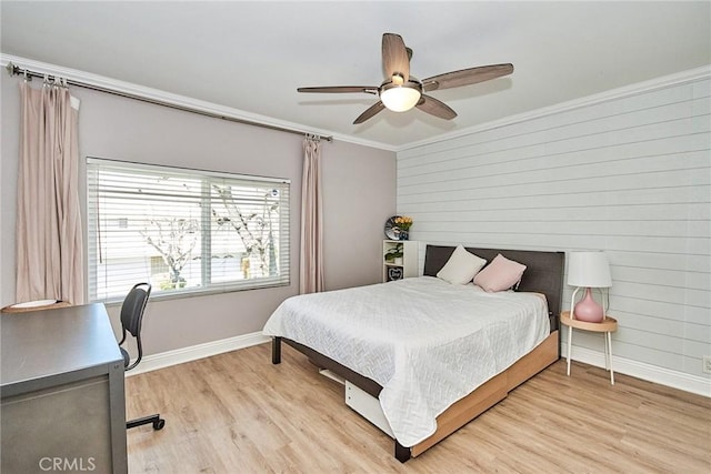 40 Eagle Pt, Irvine, CA 92604 - bedroom with ornamental molding, light wood-style flooring, ceiling fan, wooden walls, and a desk