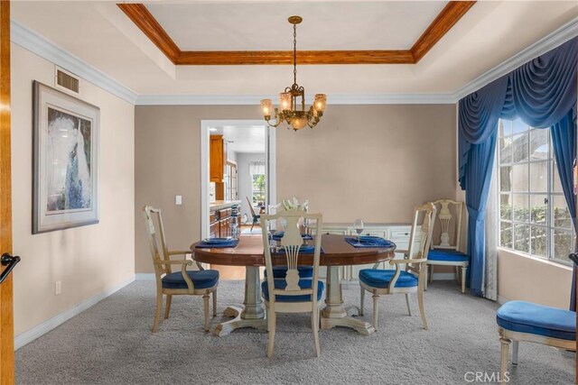530 Bradbury Rd, Monrovia, CA 91016 - carpeted dining space with a raised ceiling, a chandelier, and ornamental molding