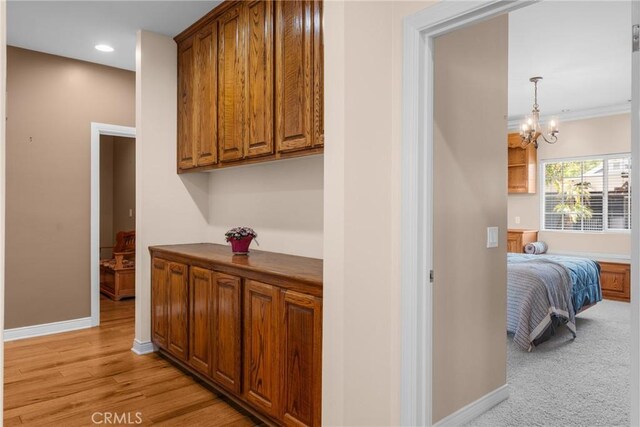530 Bradbury Rd, Monrovia, CA 91016 - corridor with a chandelier, recessed lighting, and light wood-type flooring
