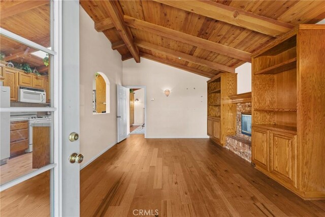 530 Bradbury Rd, Monrovia, CA 91016 - unfurnished living room with light wood-type flooring, a wooden ceiling with exposed beams, high vaulted ceiling, and a brick fireplace