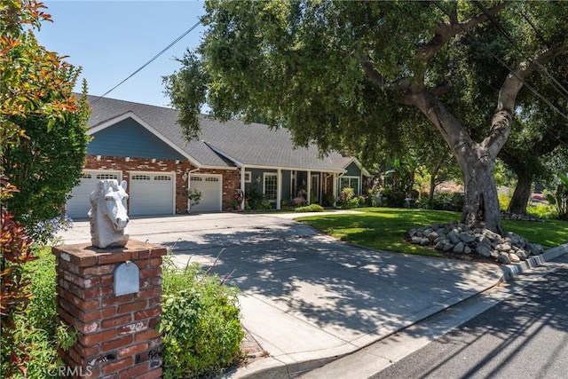 530 Bradbury Rd, Monrovia, CA 91016 - ranch-style house with an attached garage, a front lawn, concrete driveway, and brick siding