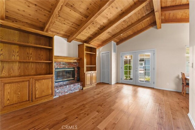 530 Bradbury Rd, Monrovia, CA 91016 - unfurnished living room with french doors, light wood-style flooring, high vaulted ceiling, a fireplace, and a wooden ceiling with exposed beams