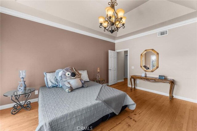 530 Bradbury Rd, Monrovia, CA 91016 - bedroom featuring a chandelier, wood finished floors, and a raised ceiling