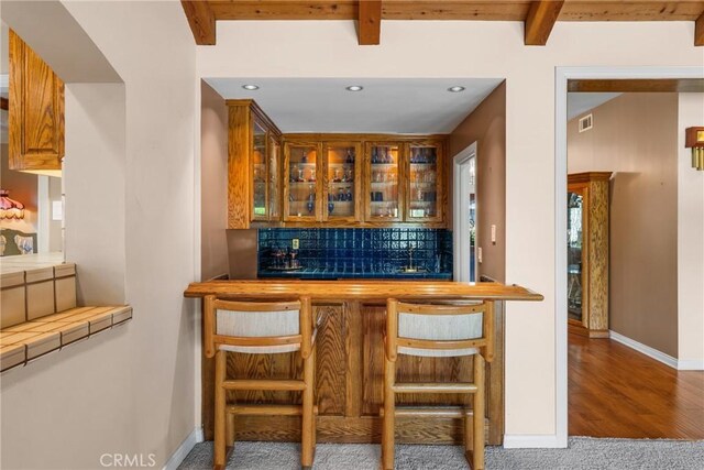 530 Bradbury Rd, Monrovia, CA 91016 - indoor wet bar with tasteful backsplash, beam ceiling, recessed lighting, and wood finished floors