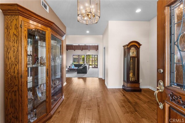 530 Bradbury Rd, Monrovia, CA 91016 - entryway featuring hardwood / wood-style floors and a chandelier
