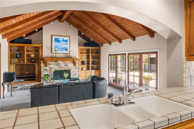530 Bradbury Rd, Monrovia, CA 91016 - carpeted living area featuring wooden ceiling and a brick fireplace