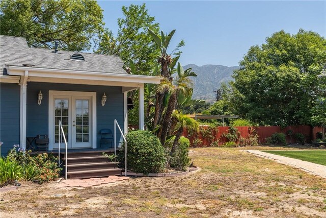 530 Bradbury Rd, Monrovia, CA 91016 - view of yard featuring french doors, a mountain view, and covered porch
