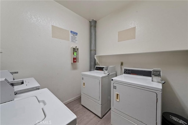 4706 Sepulveda Blvd, Sherman Oaks, CA 91403 - communal laundry room with washing machine and clothes dryer and light wood finished floors