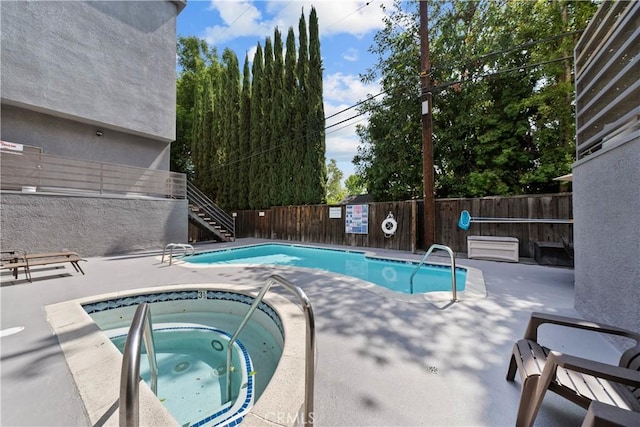 4706 Sepulveda Blvd, Sherman Oaks, CA 91403 - community pool featuring a hot tub, stairs, a fenced backyard, and a patio