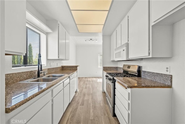 4706 Sepulveda Blvd, Sherman Oaks, CA 91403 - kitchen with white appliances, light wood-style floors, and white cabinetry