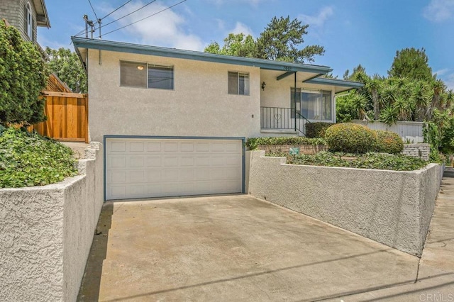 3448 Goldfinch St, San Diego, CA 92103 - view of front facade with a garage, stucco siding, and concrete driveway