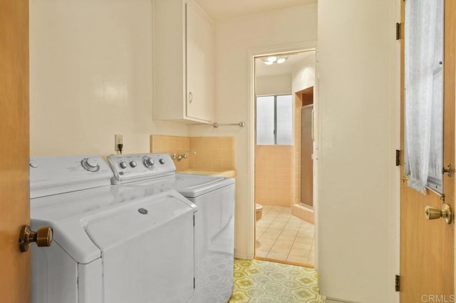 3448 Goldfinch St, San Diego, CA 92103 - washroom featuring washer and clothes dryer and cabinet space